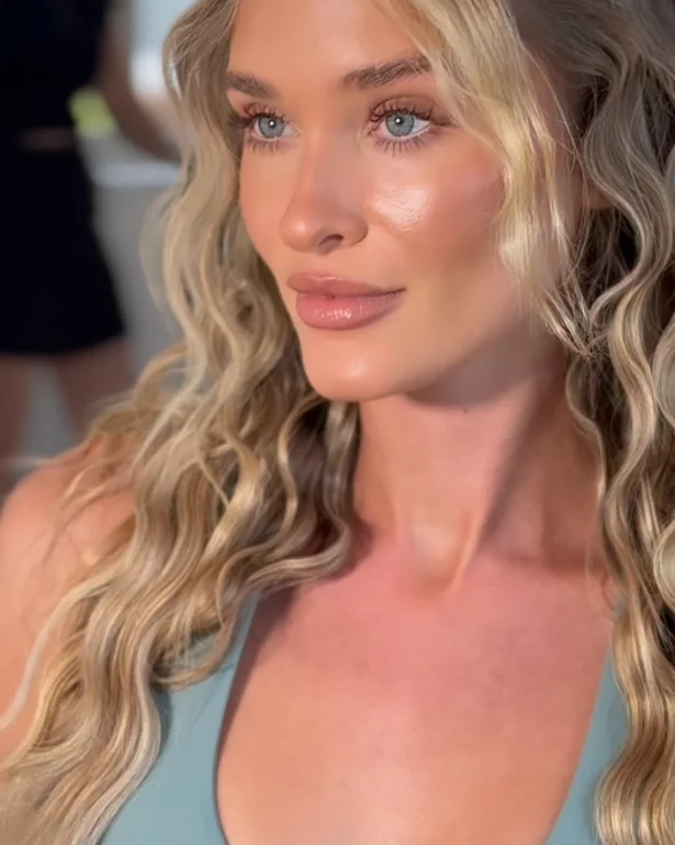 A bride with long blonde waves and a soft, glowing makeup look.